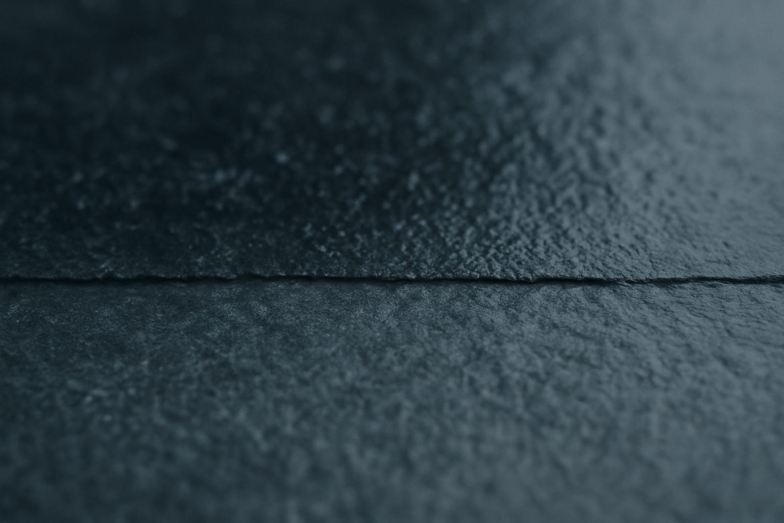 A surface part wet, part drying. The boundary between the two states is where material fails.